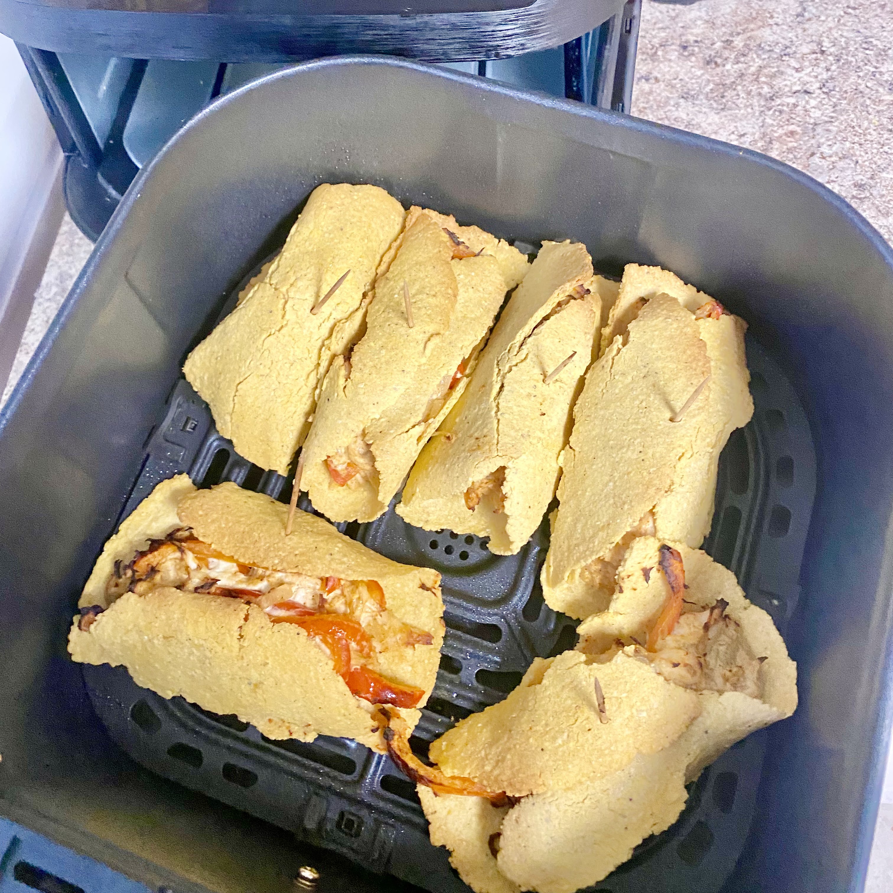 homemade taquitos with guacamole on top