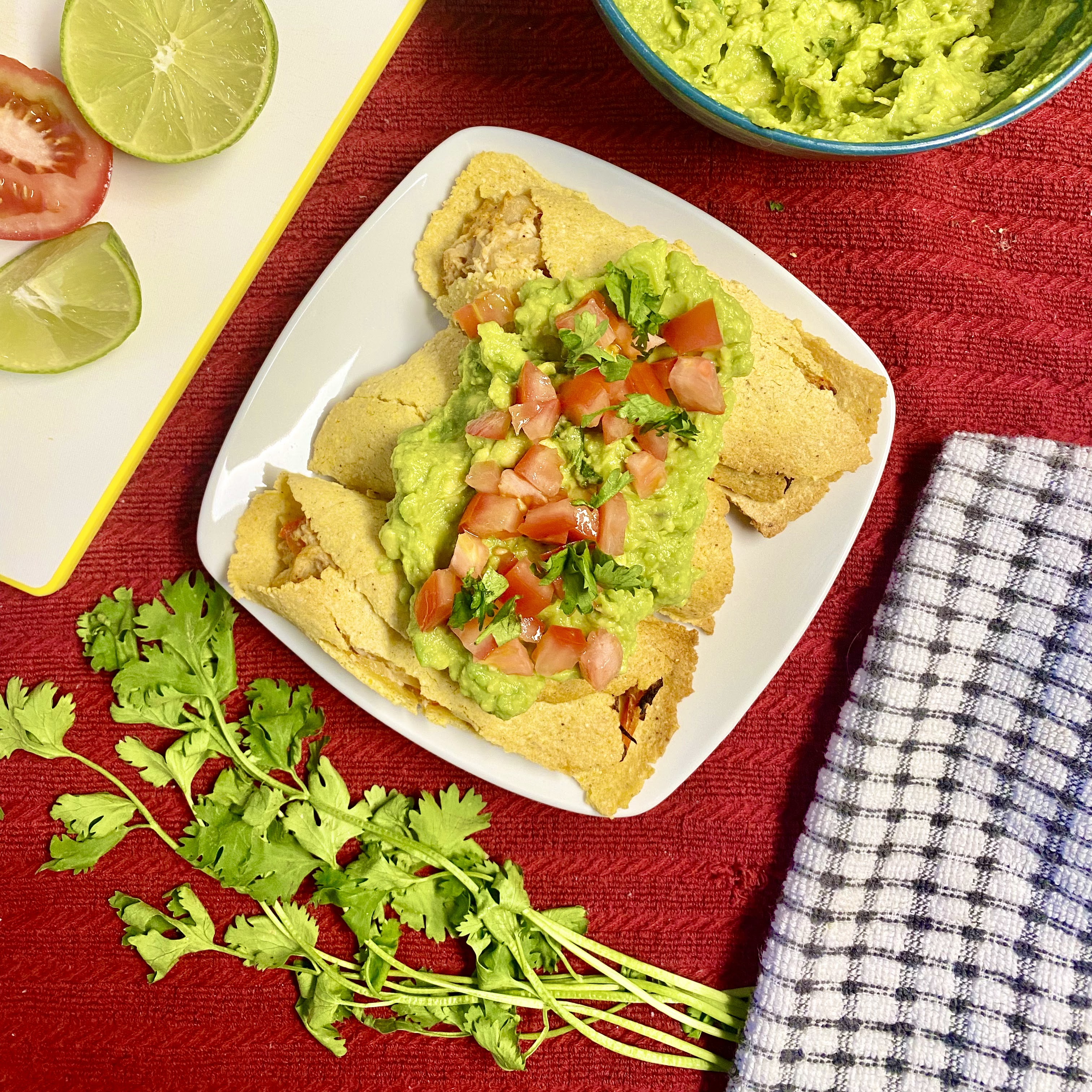 homemade taquitos with guacamole on top