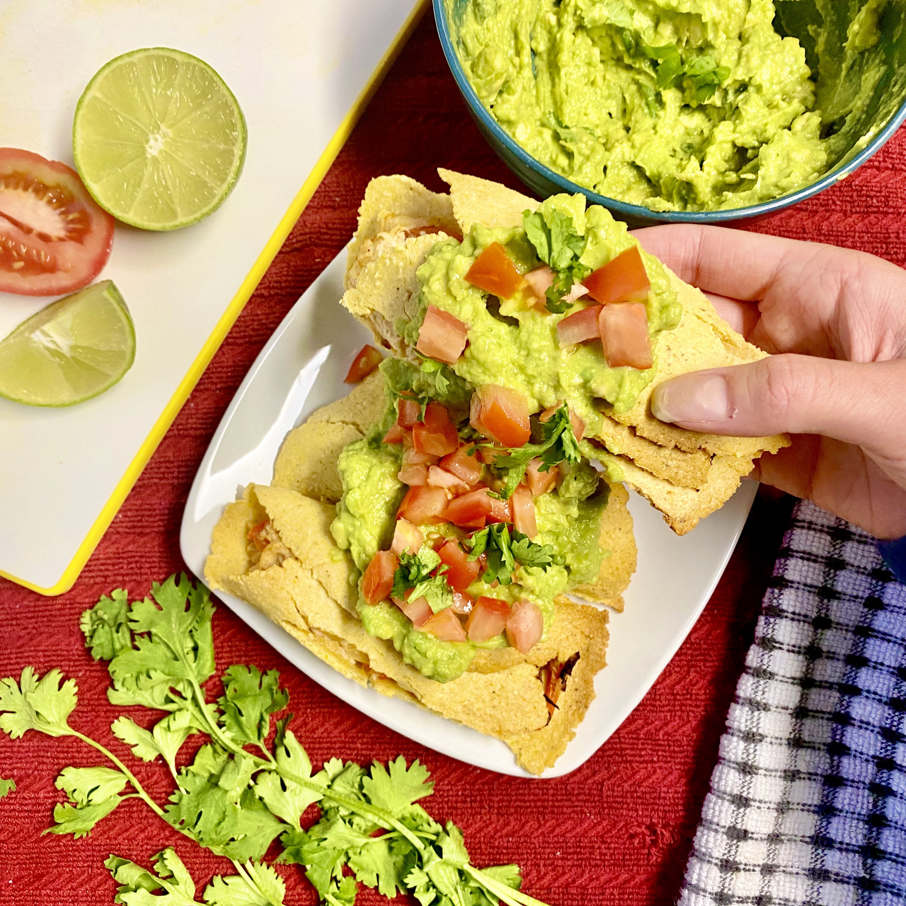 homemade taquitos with guacamole on top