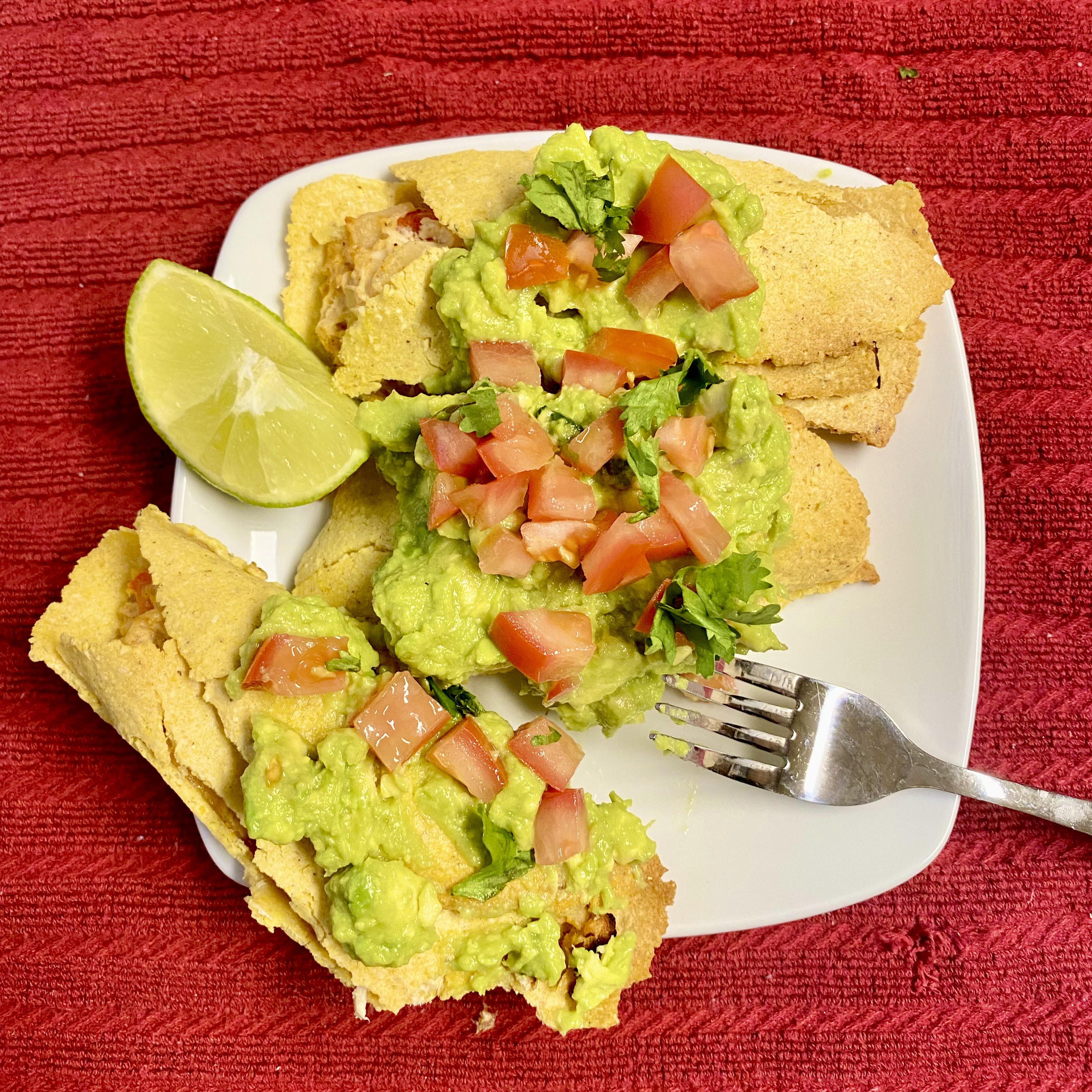 homemade taquitos with guacamole on top