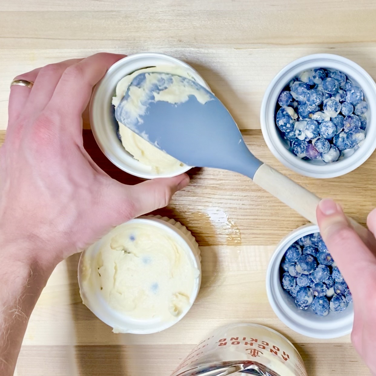 Blueberry cobbler in a ramekin, topped with ice cream