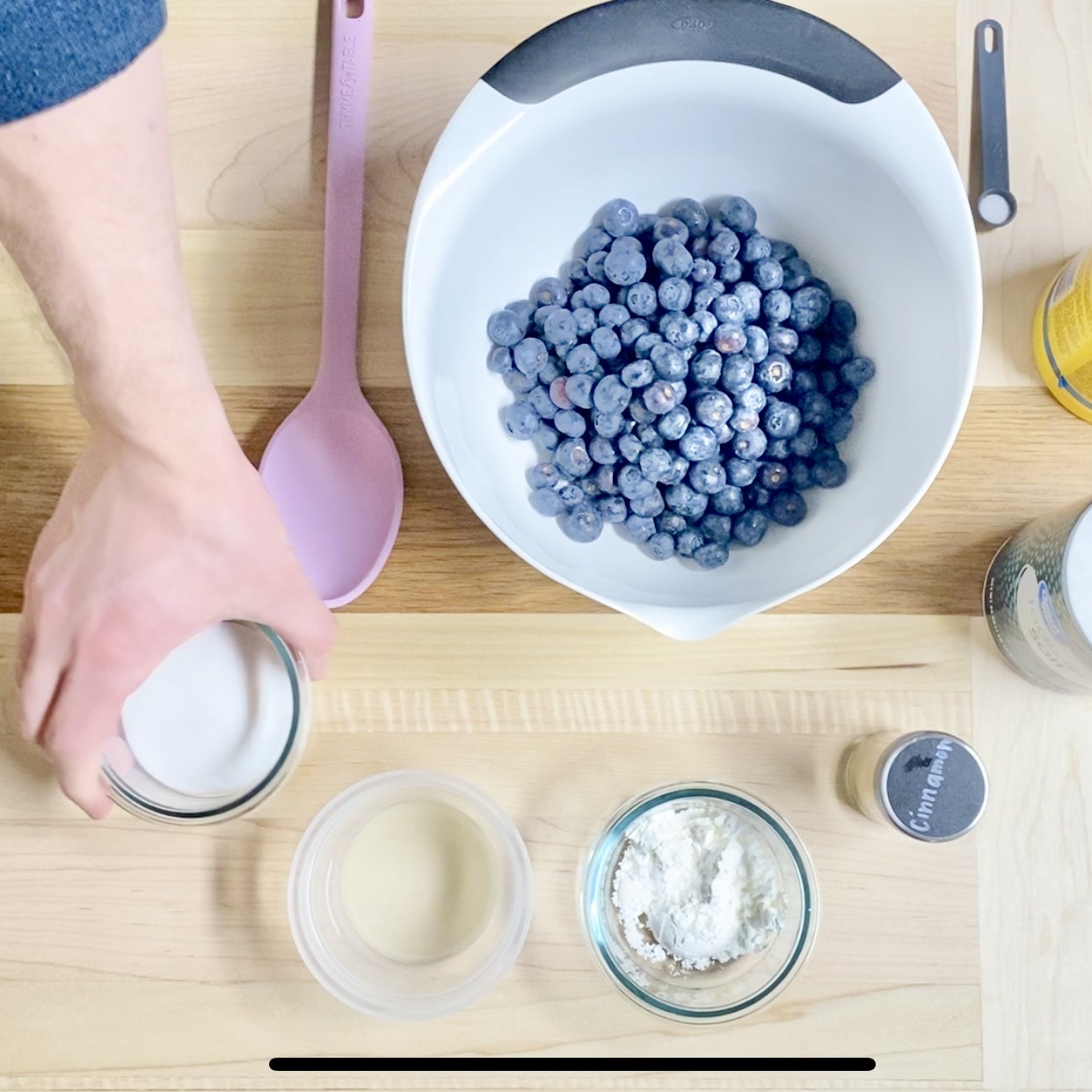 Blueberry cobbler in a ramekin, topped with ice cream