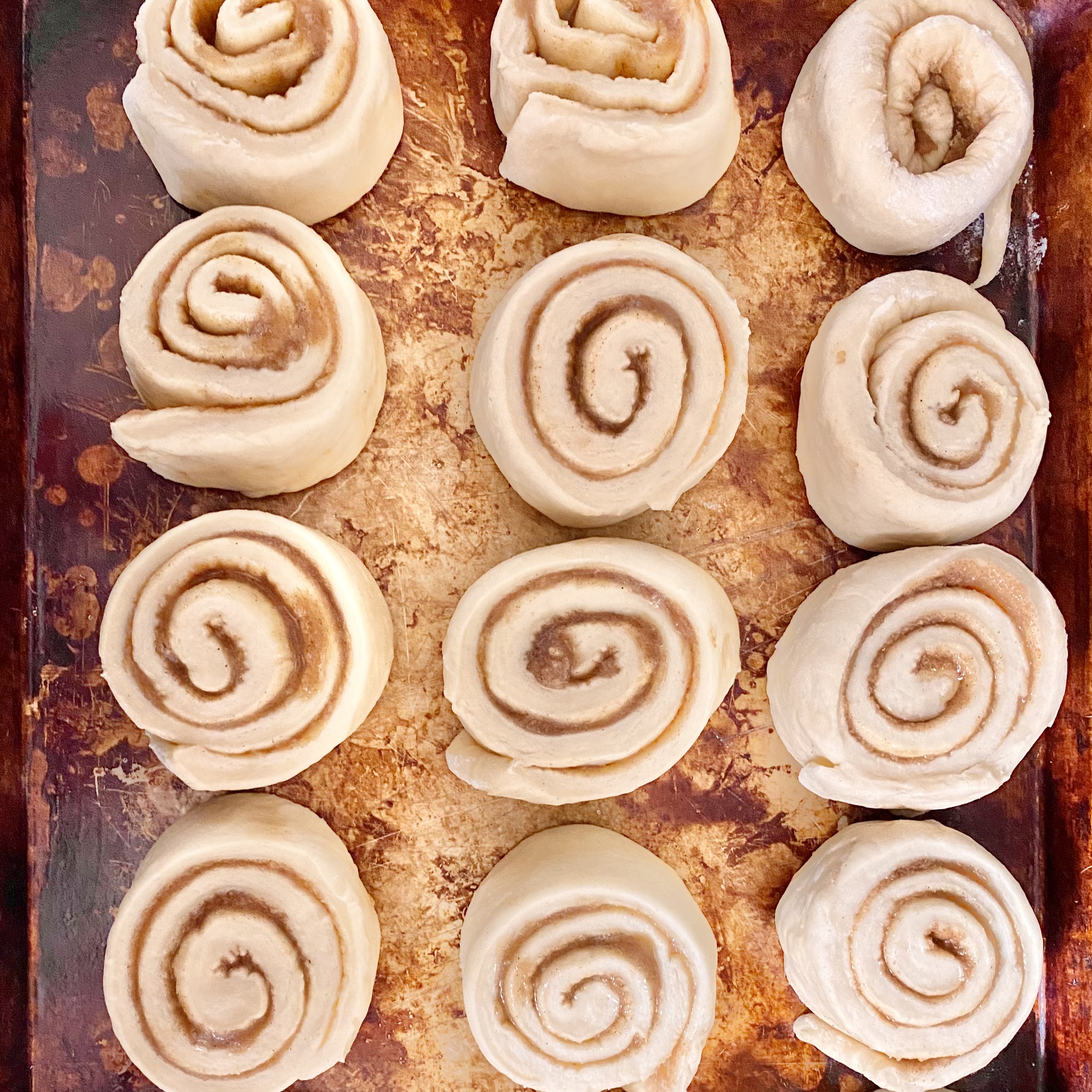 Warm cinnamon roll with frosting dripping down