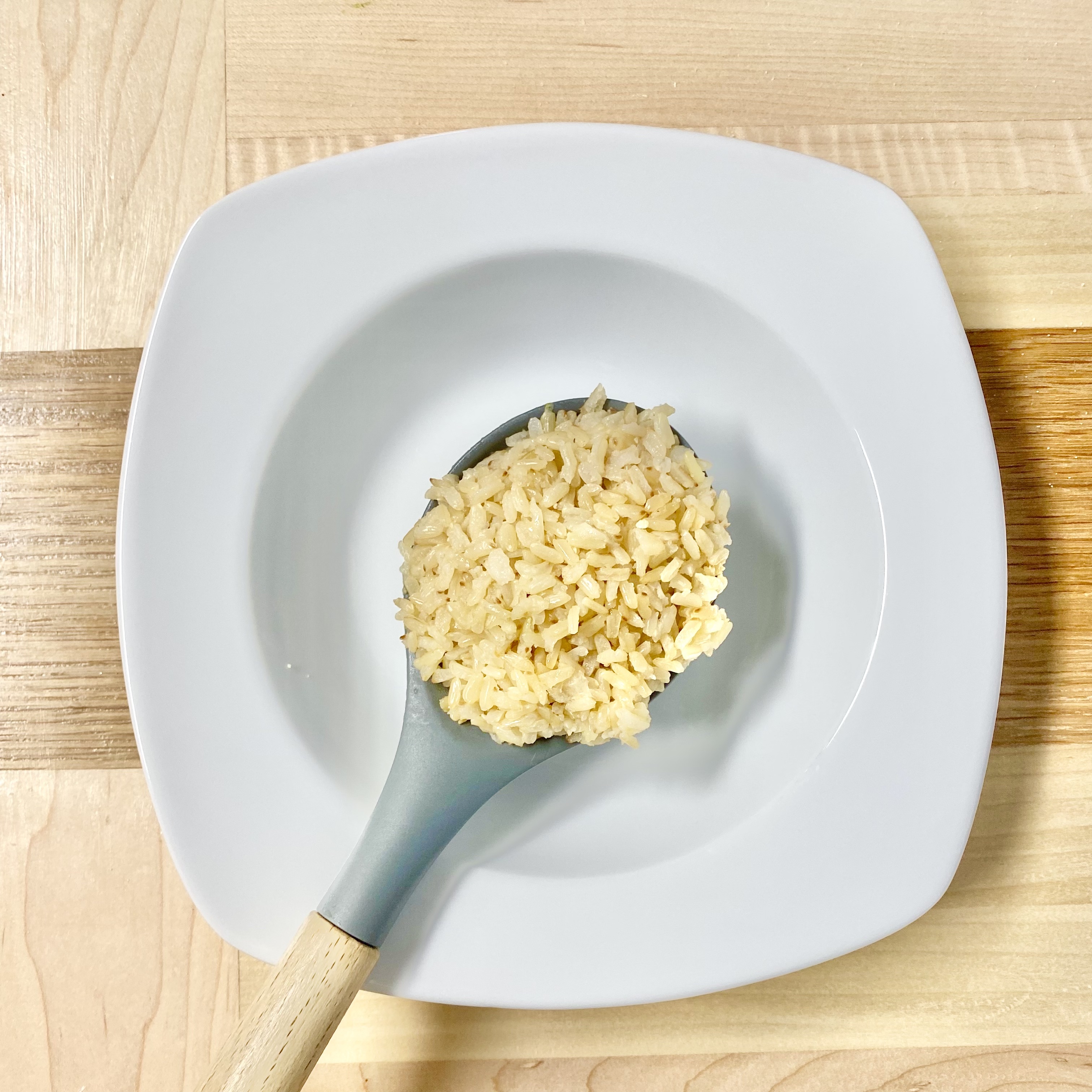 brown rice in a bowl with a fork