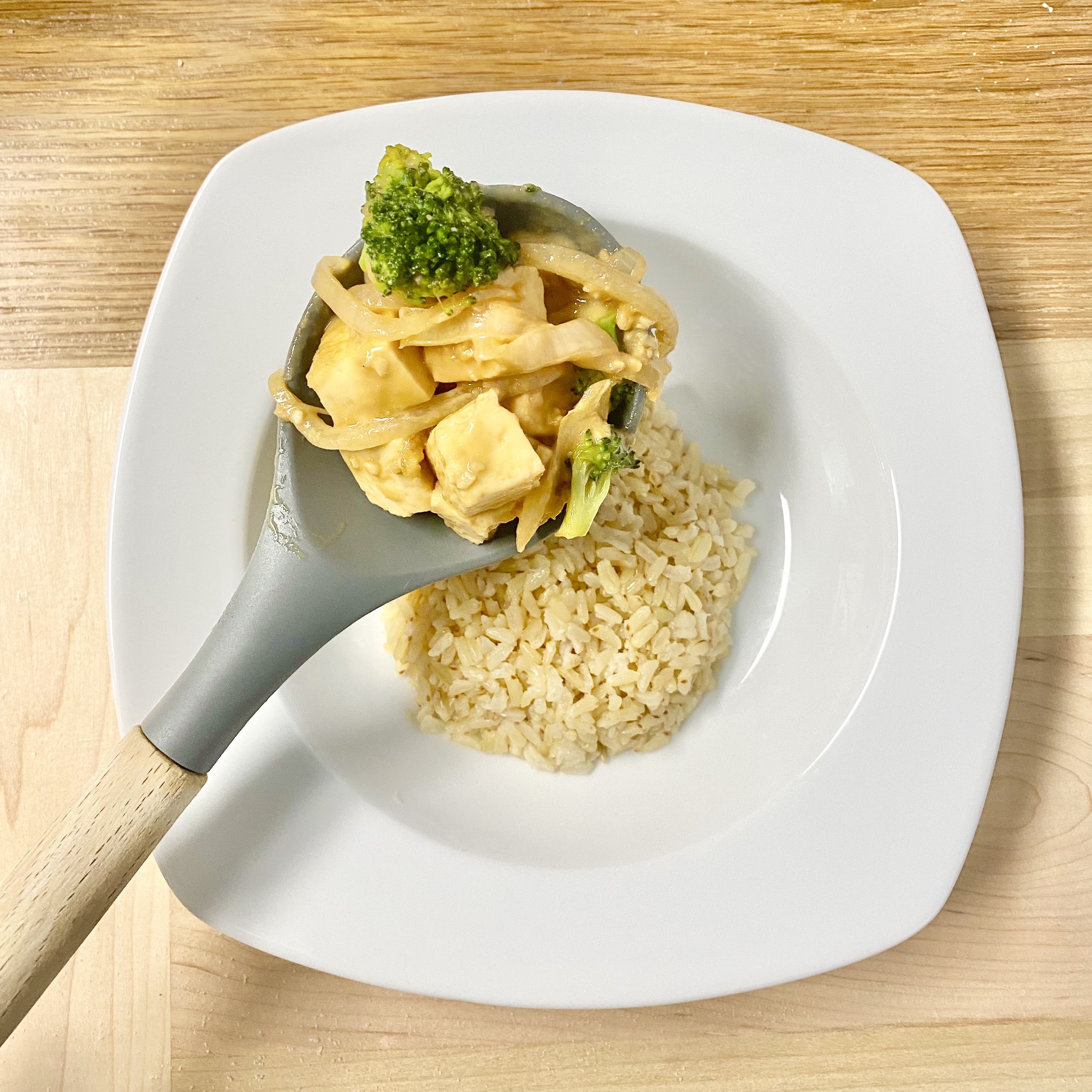 brown rice in a bowl with a fork