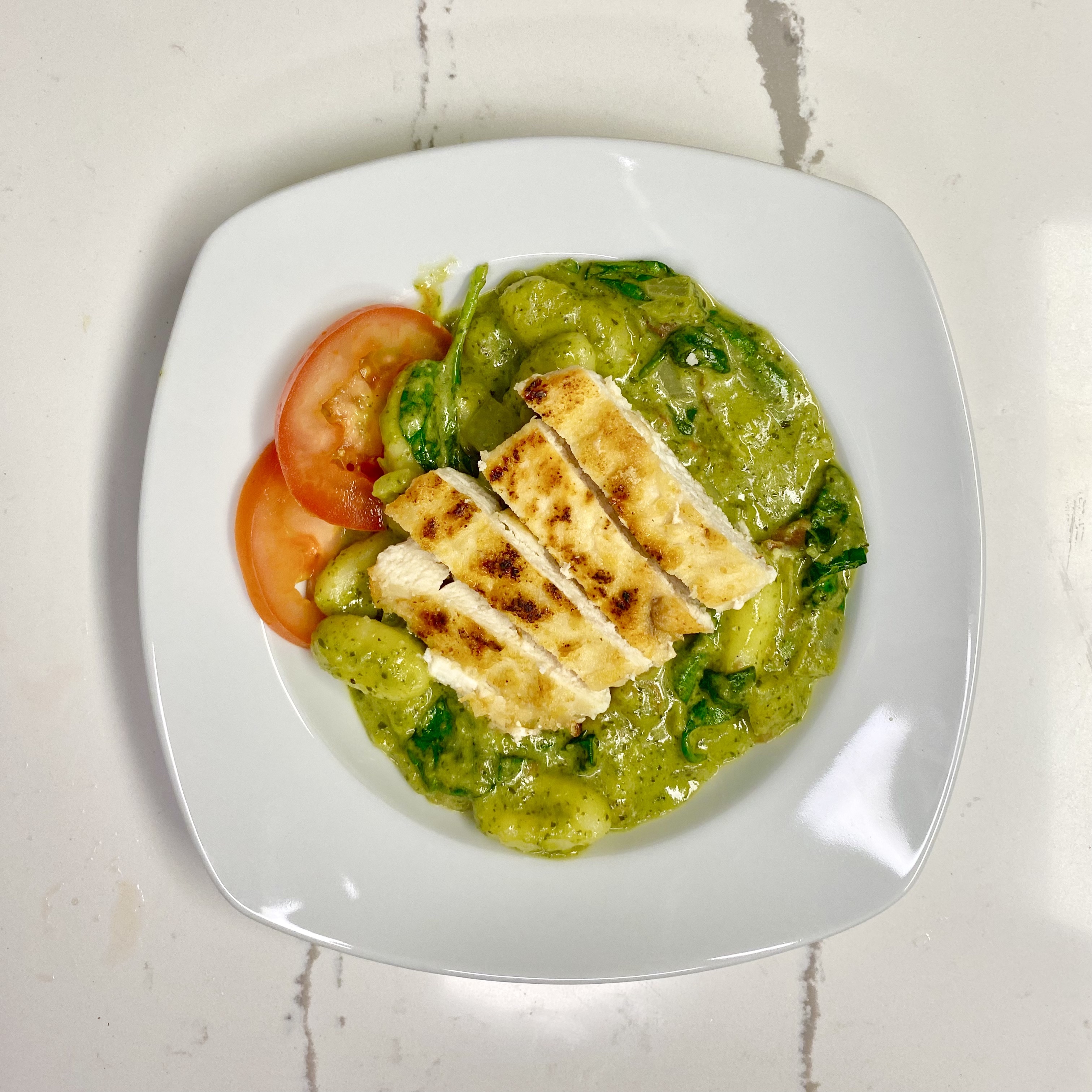 pesto chicken gnocchi in a bowl