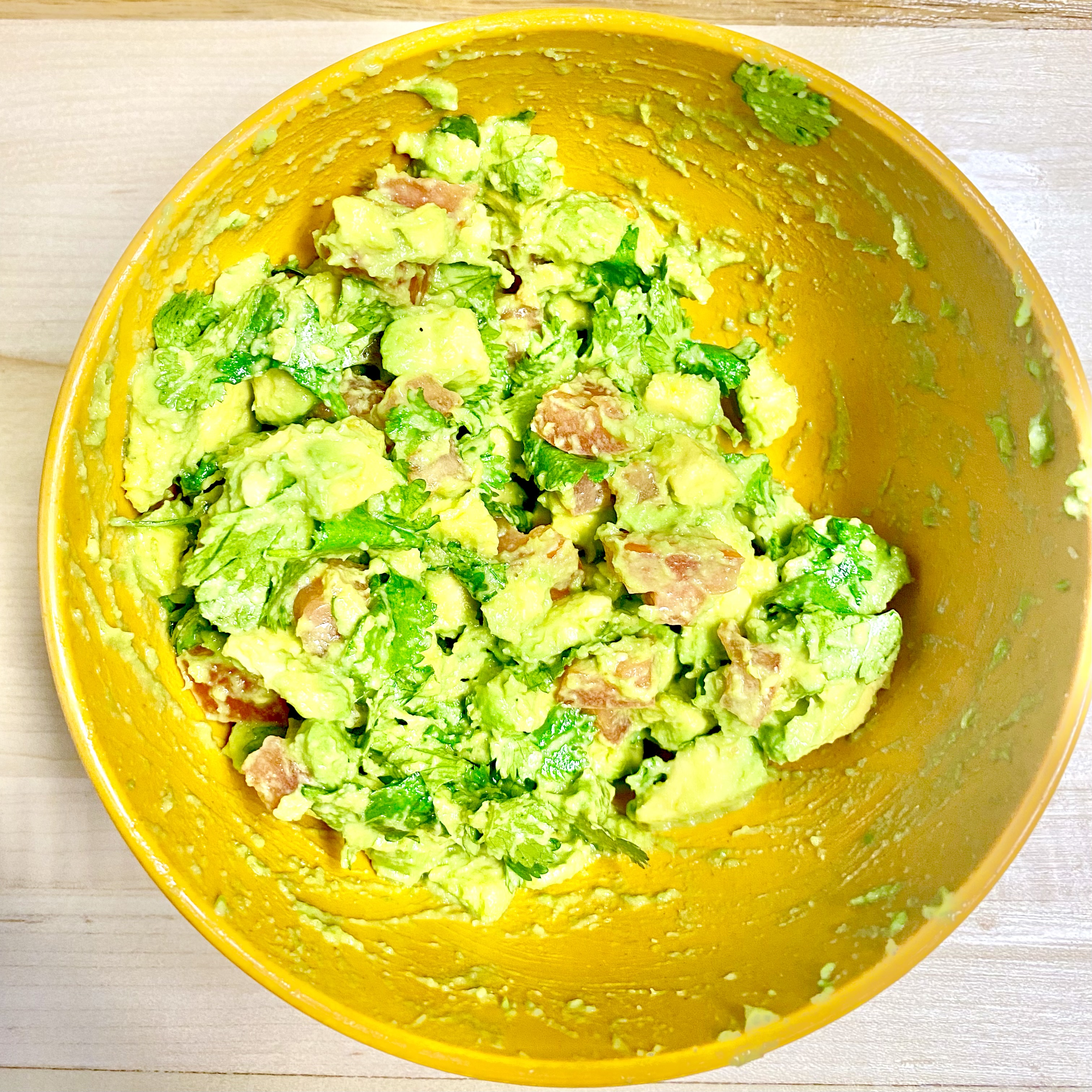 Chicken, beans, guacamole on a plate